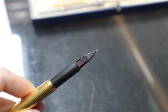 A Dunhill gold-plated fountain pen, 14ct gold nib, a miniature guilloche enamel propelling pencil and eight other items